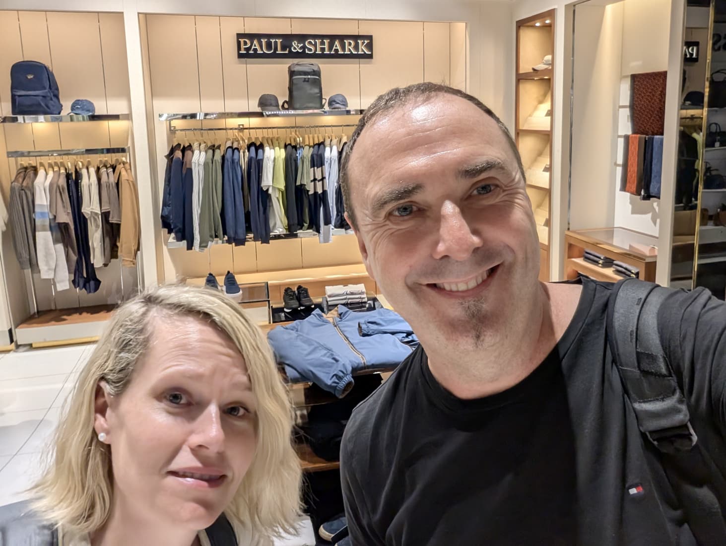 Paul Seymour and Demelza Green standing in front of Paul & Shark luxury fashion store